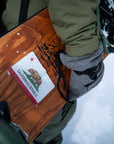 california flag snowboard stomp pad being carried