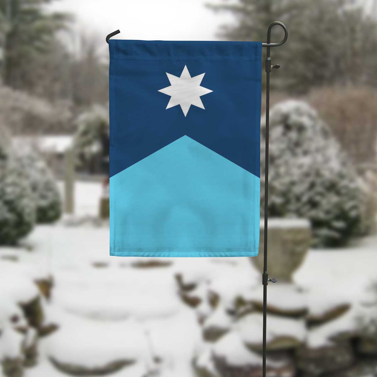 Vertical Minnesota State Flag Garden Flag on a pole in snow by Flags For Good