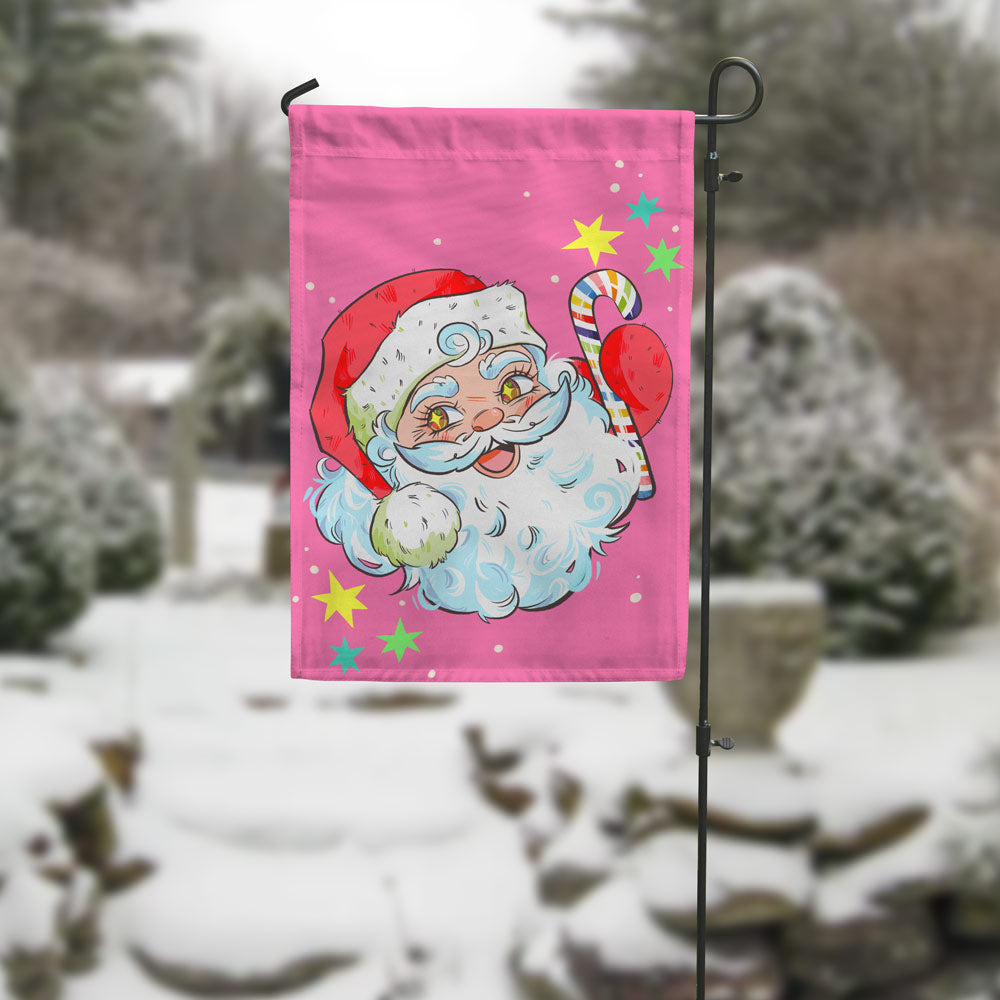 rainbow santa garden flag in wintery garden setting