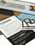 Progress Pride Flag by Flags For Good unfolded showing the insert and sticker