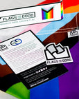 Progress Pride Garden Flag unfolded showing the insert and sticker