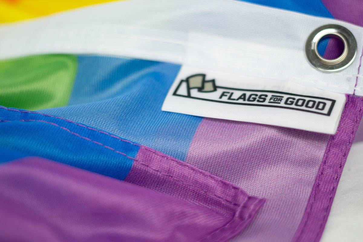 Flags For Good tag on a rainbow pride flag