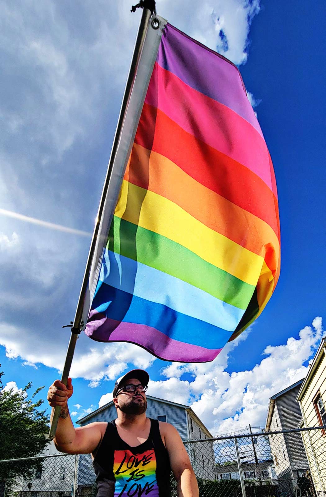 9-Stripe LGBTQ+ Gilbert Baker Pride Flag being flown on a pole