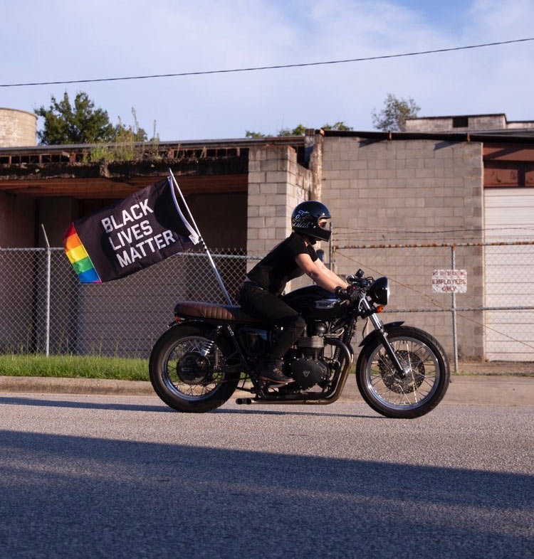 Motorcycle with a Black Lives Matter Pride flag