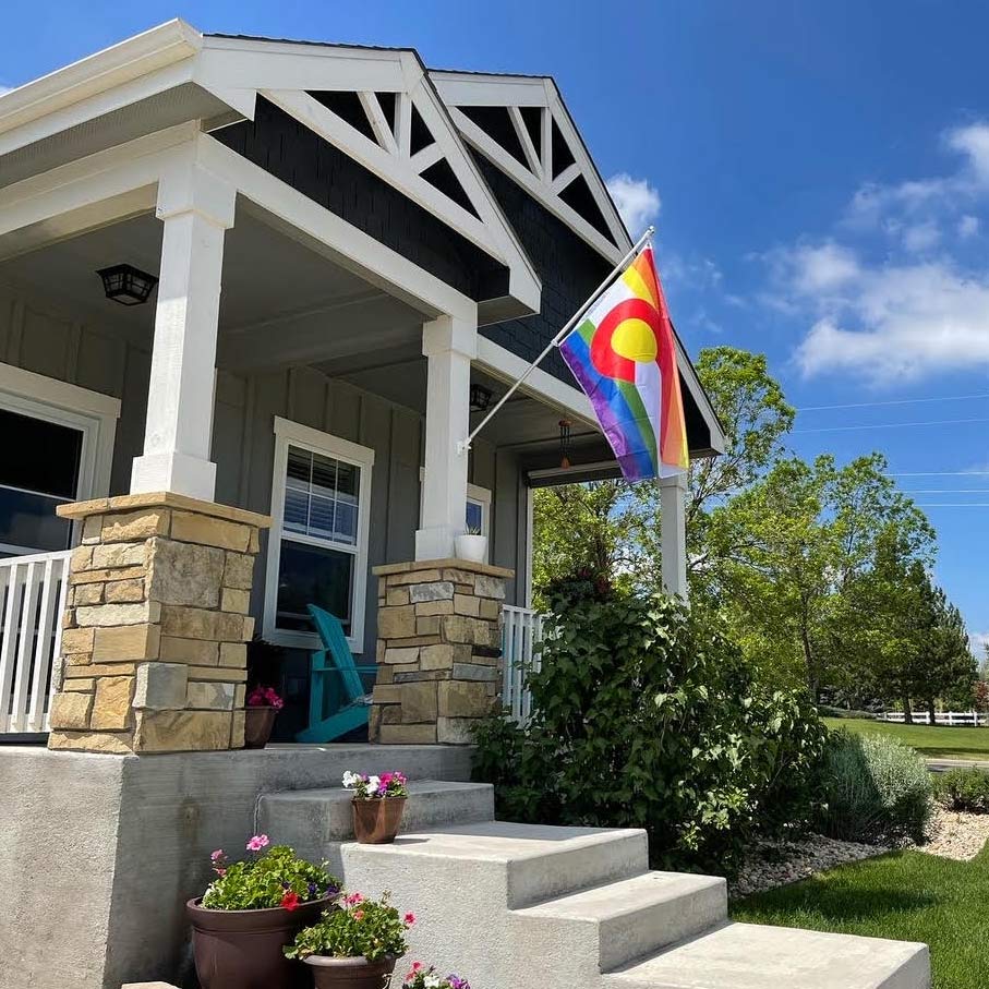 rainbow colorado state pride flag on a house