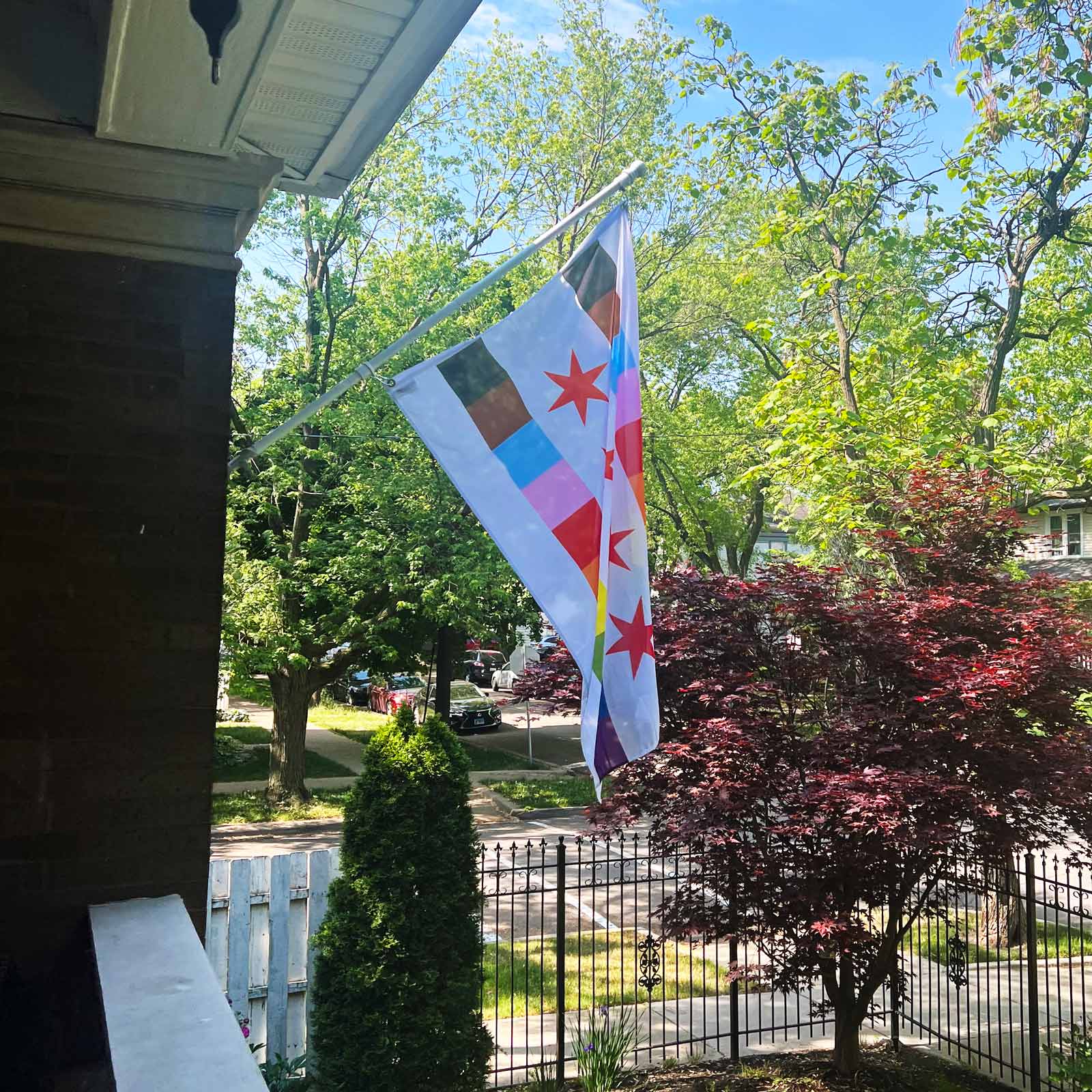 Chicago LGBTQ+ gay pride flag on a house flag pole