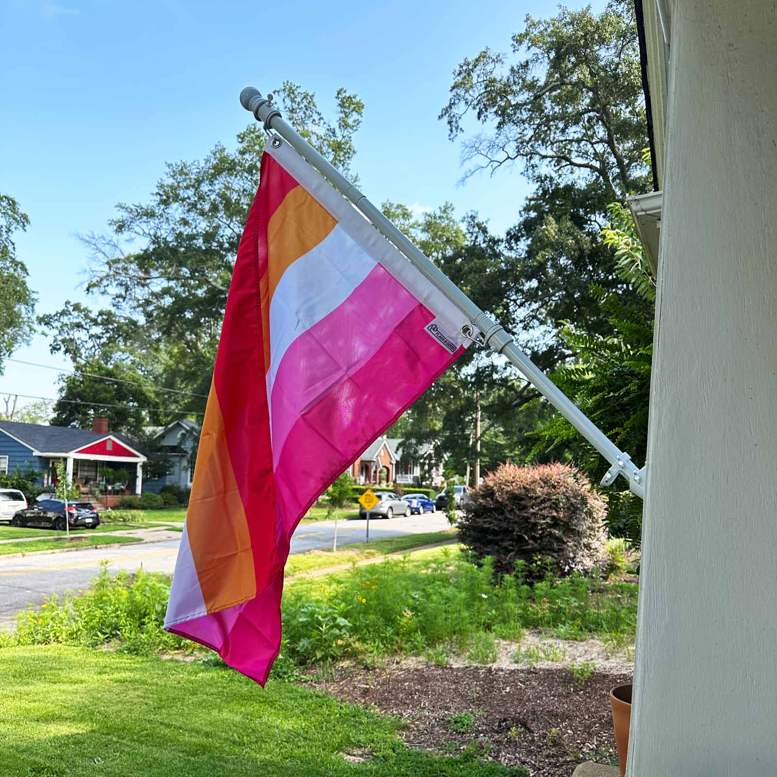 5 stripe Lesbian Pride Flag on a house