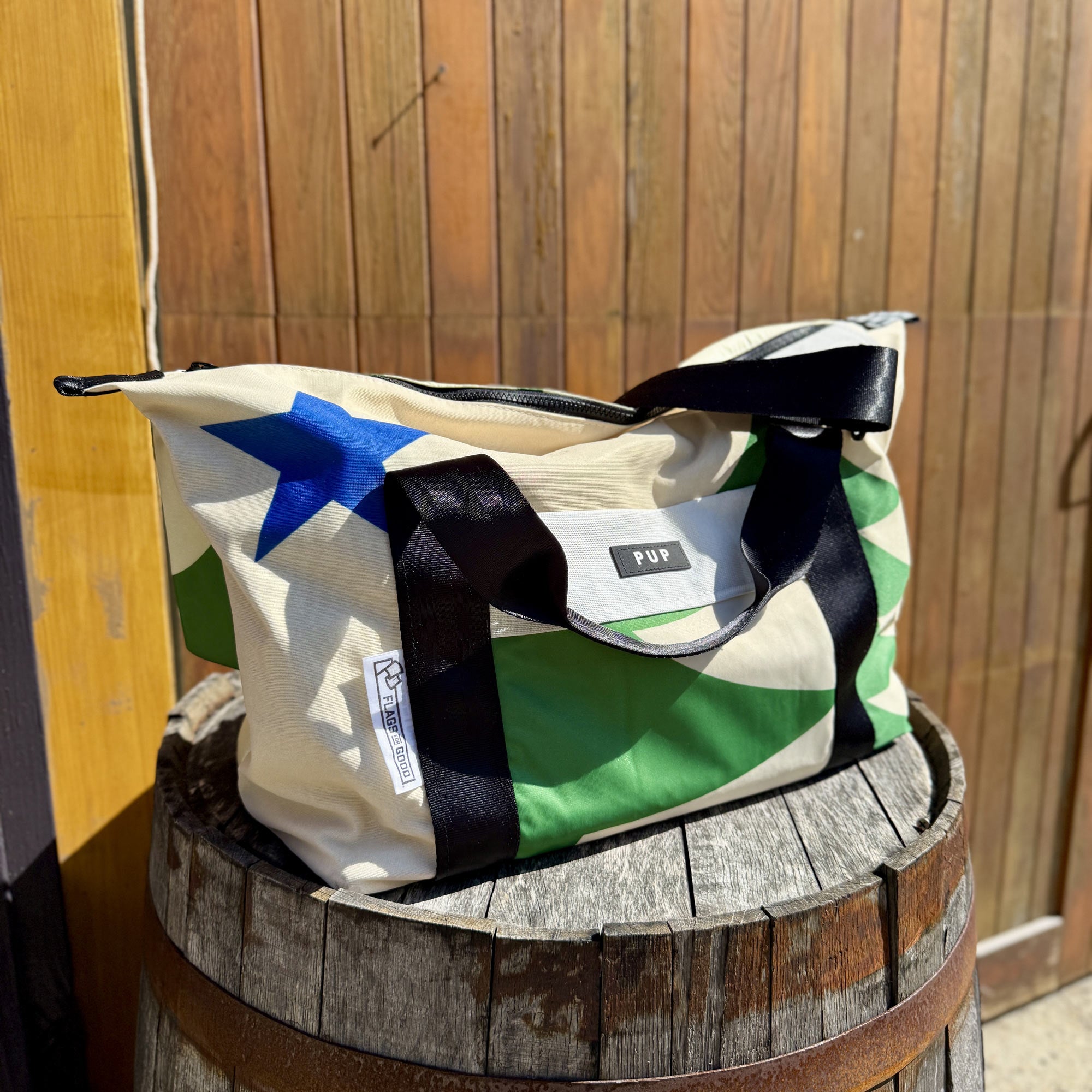 Maine 1901 repurposed flags into a weekender bag