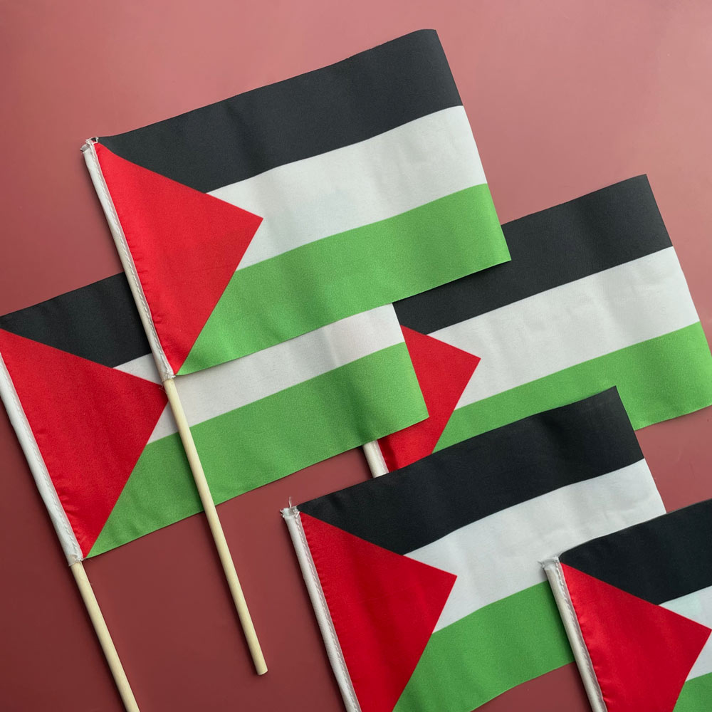 five hand stick Palestine flags