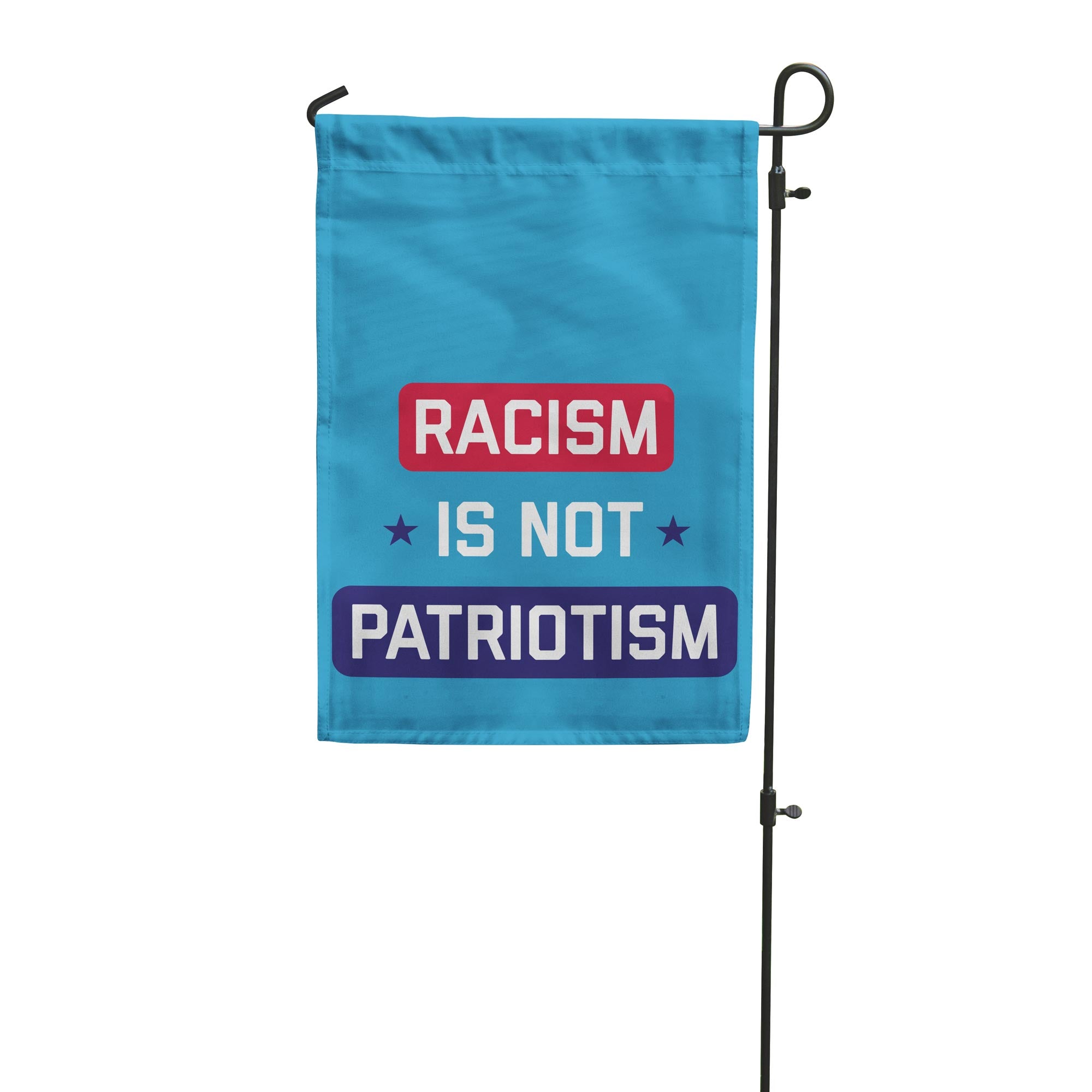 Garden flag with 'Racism is not patriotism' text on a blue background
