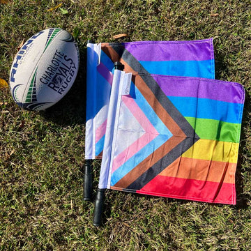 Rugby and Soccer Referee Progress Flag Flat Lay Image in Grass 