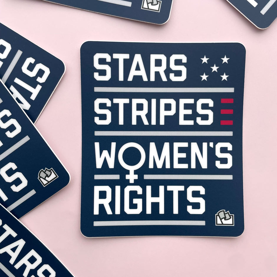 A blue sticker with the text "Stars Stripes Women's Rights" on a pink background