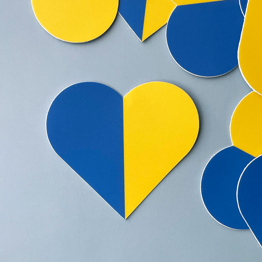 Heart sticker with the Ukraine flag creating the two halves