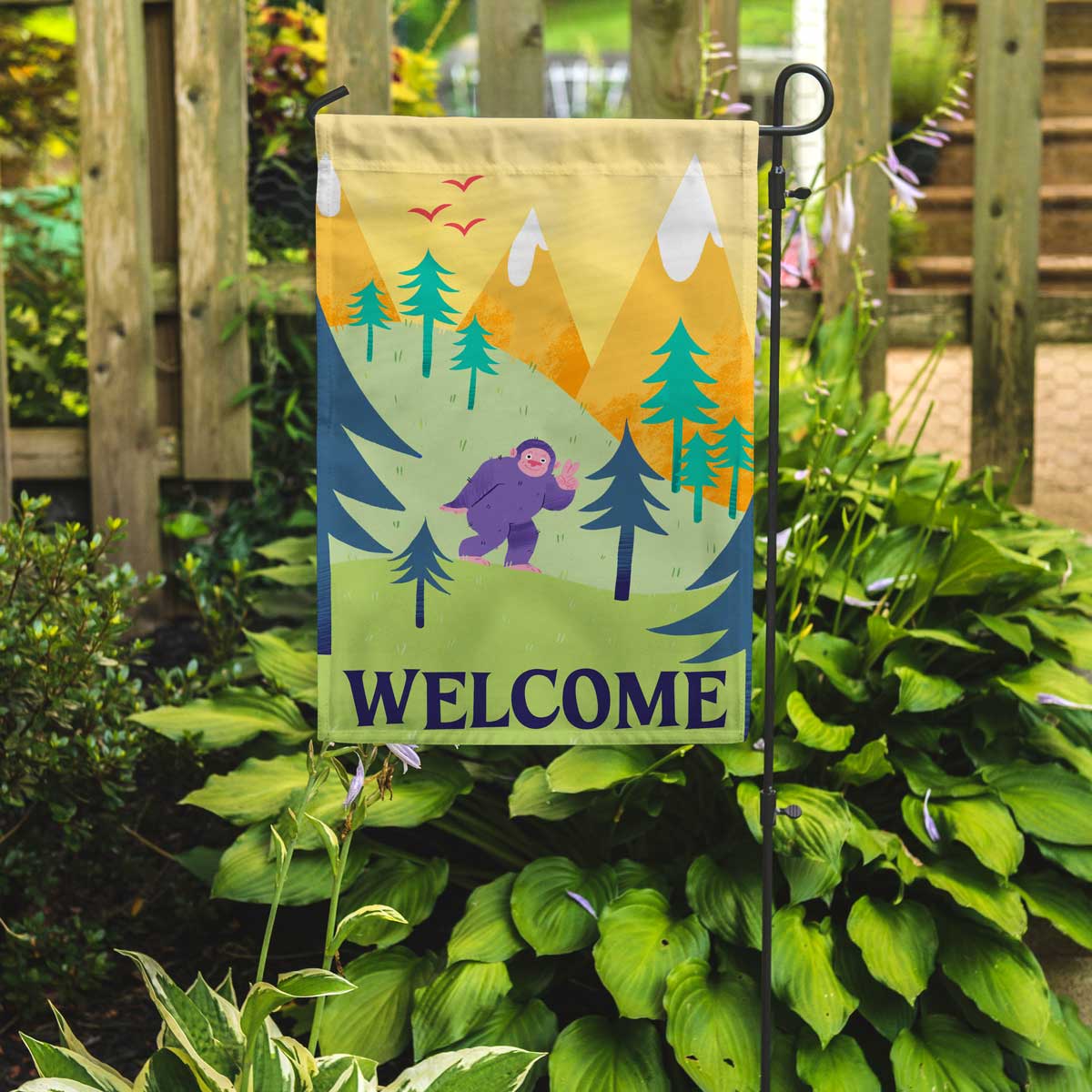 Bigfoot welcome flag in garden setting by flags for good