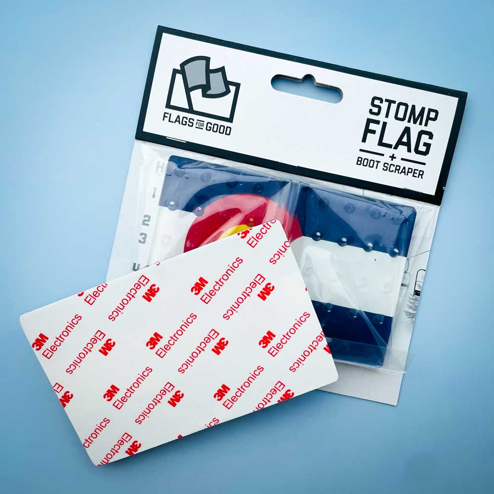 Colorado Flag Snowboard Stomp Pad by Flags For Good and its packaging showing the 3M backing