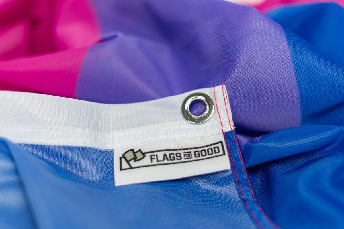Bisexual pride Flag by Flags For Good showing the branded tag and grommet