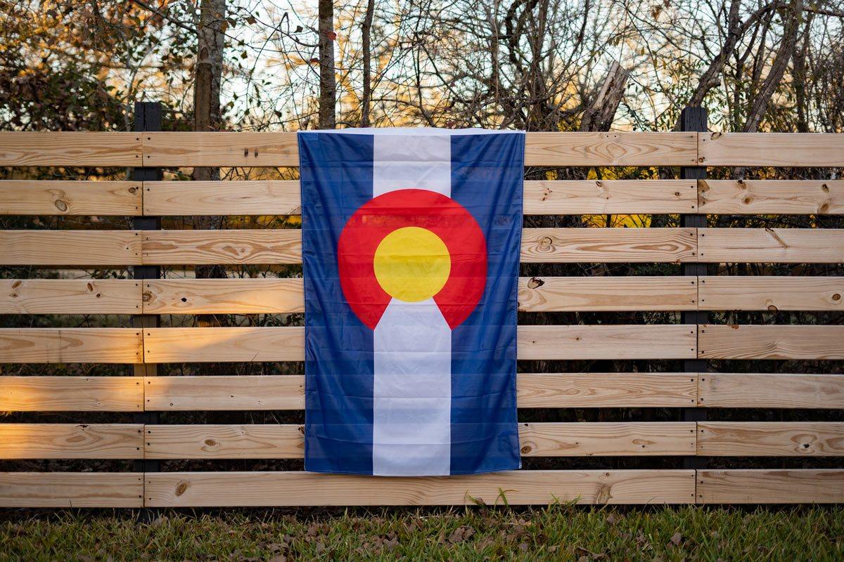 colorado state flag on a fence