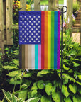 "for all" u.s. garden flag placed in a garden