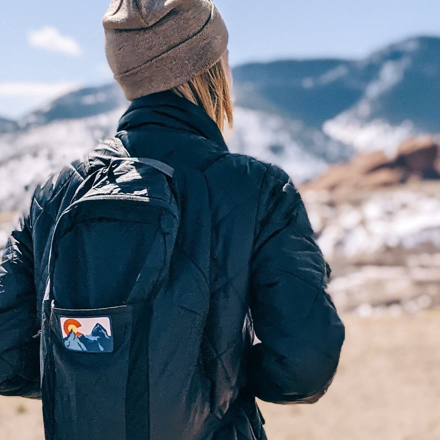 Colorado patch on a hiker's backpack 