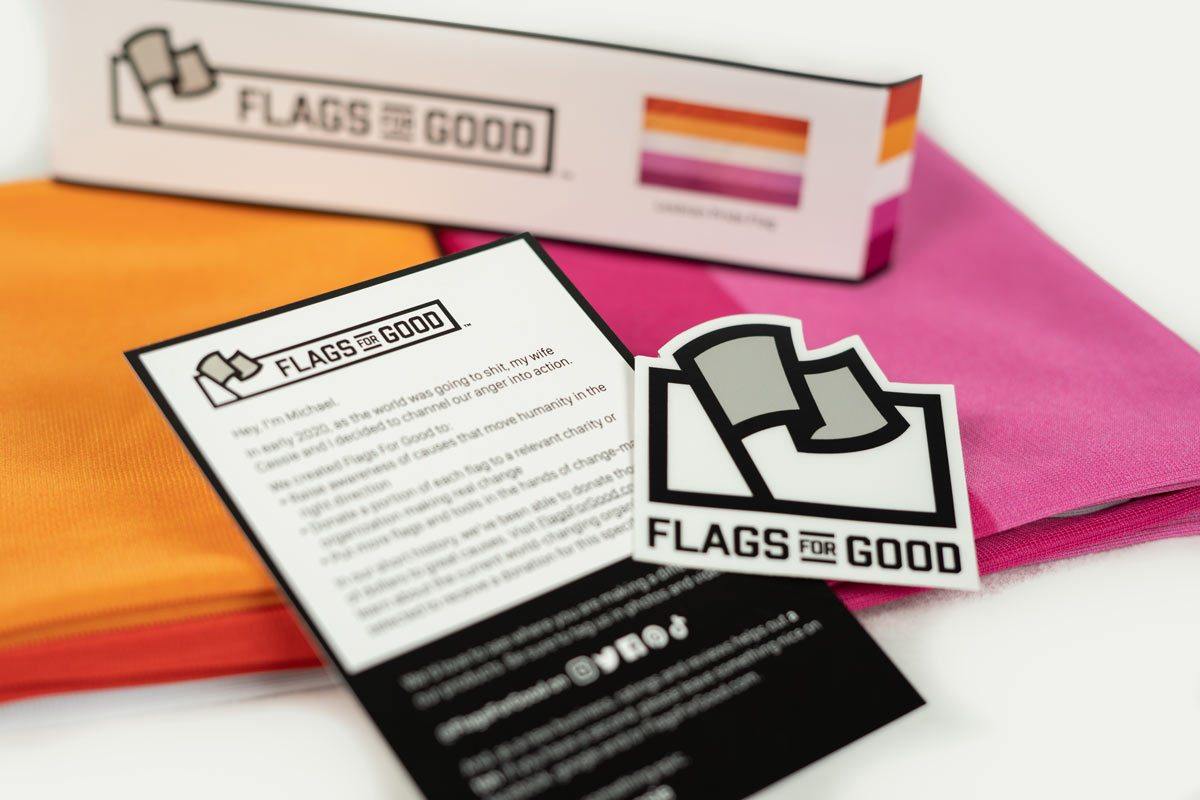 5 stripe Lesbian Pride Flag unfolded with insert card and sticker