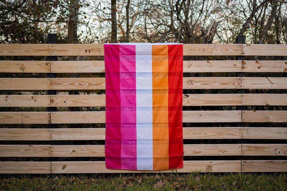 our Lesbian flag hanging on a fence