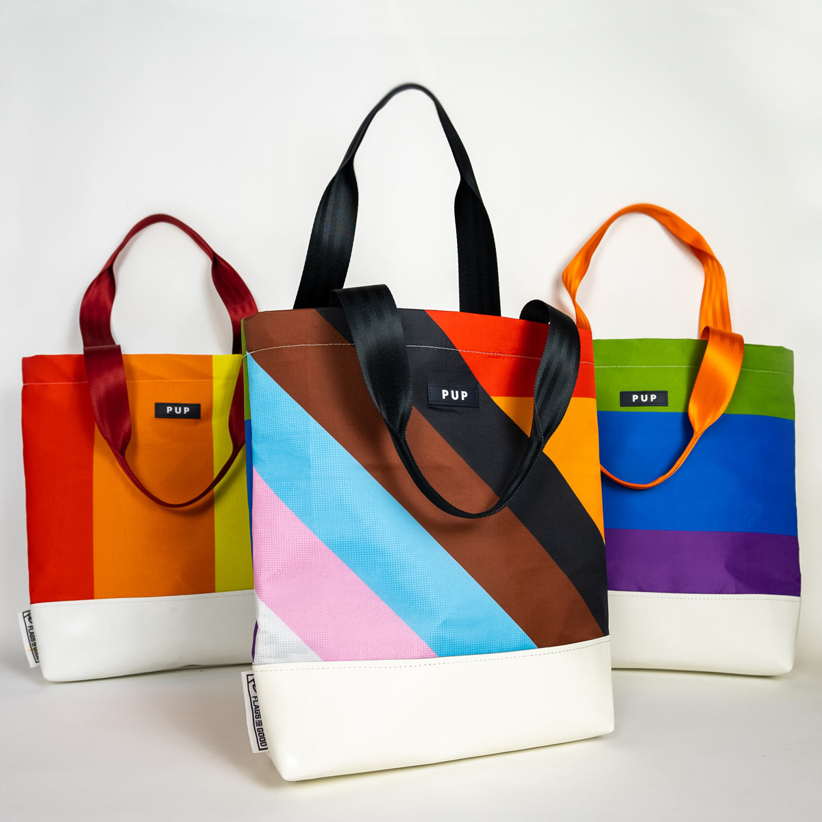 Upcycled Progress Pride Flag Tote Bag Group Shot - Flags For Good X PUP