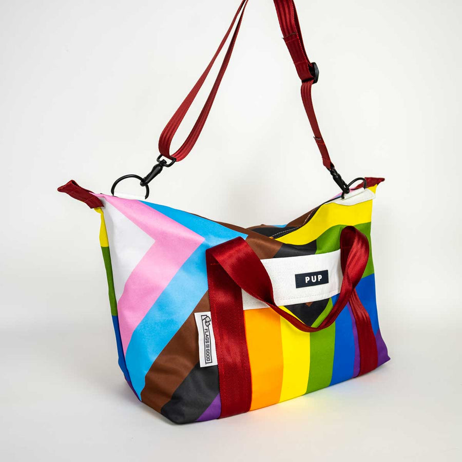 Upcycled Progress Pride Flag Weekender Bag with maroon strap - Flags For Good X PUP