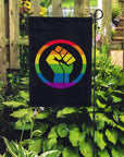 Rainbow Pride BLM fist in a garden