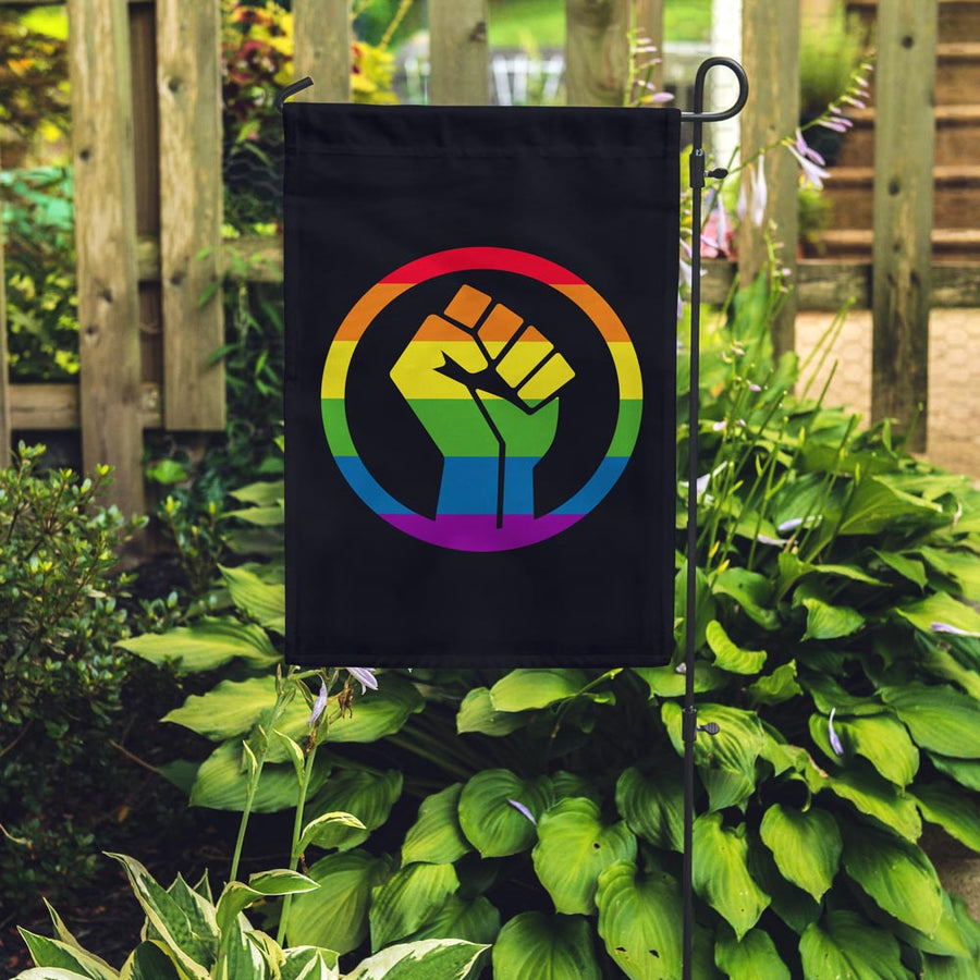 Rainbow Pride BLM fist in a garden