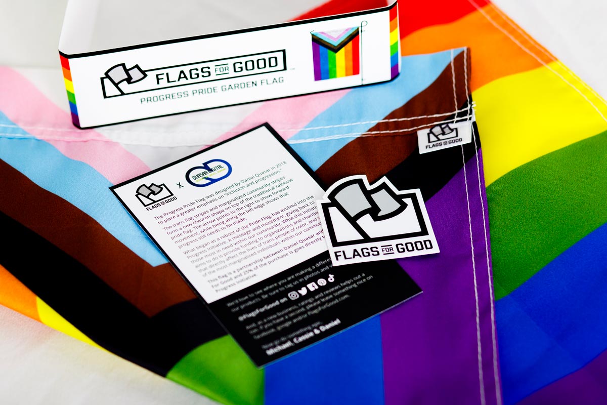 Progress Pride Garden Flag unfolded showing the insert and sticker