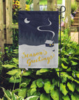 seasons greetings garden flag with garden background