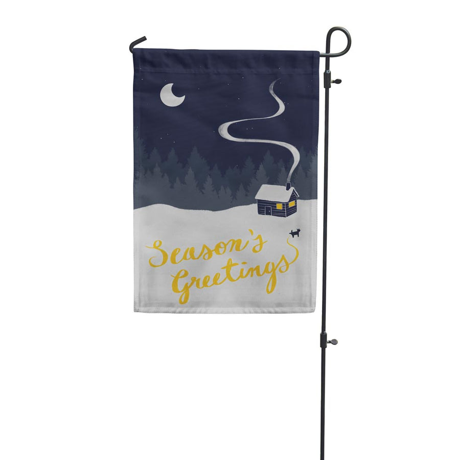 seasons greetings garden flag with dog peeing in snow on a beautiful winter night