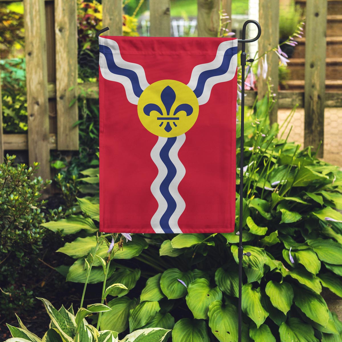 st louis flag posted in a garden