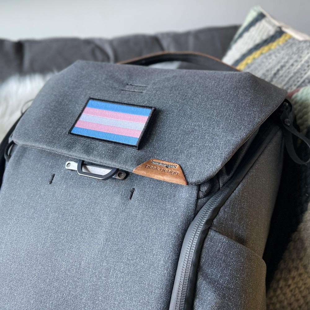 Trans Pride Flag Patch on a backpack